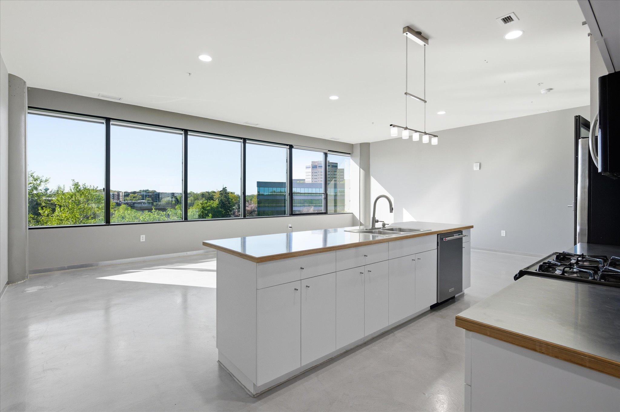 Large windows flood the space with natural light, enhancing openness and comfort.