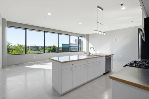 Large windows flood the space with natural light, enhancing openness and comfort.