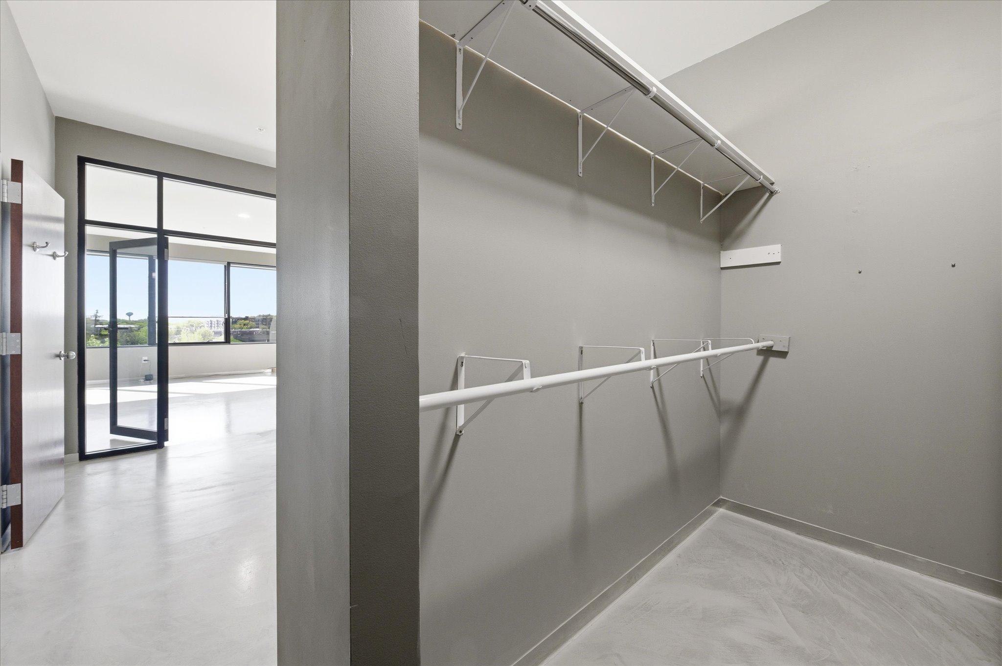 Tucked-away closet with a clean, modern design maximizing storage efficiency.