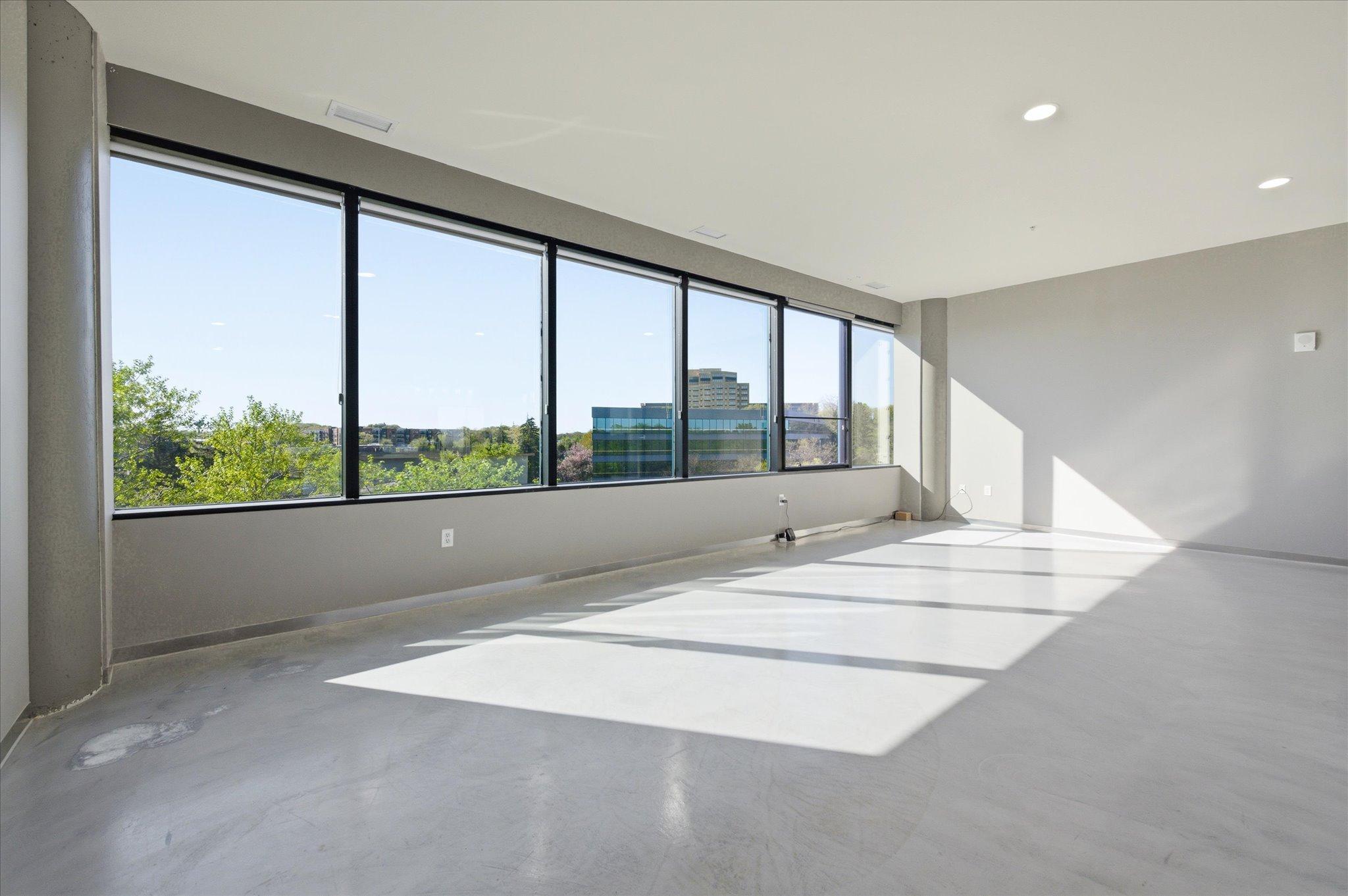 Bright, modern living space filled with natural light, creating a warm and inviting atmosphere.