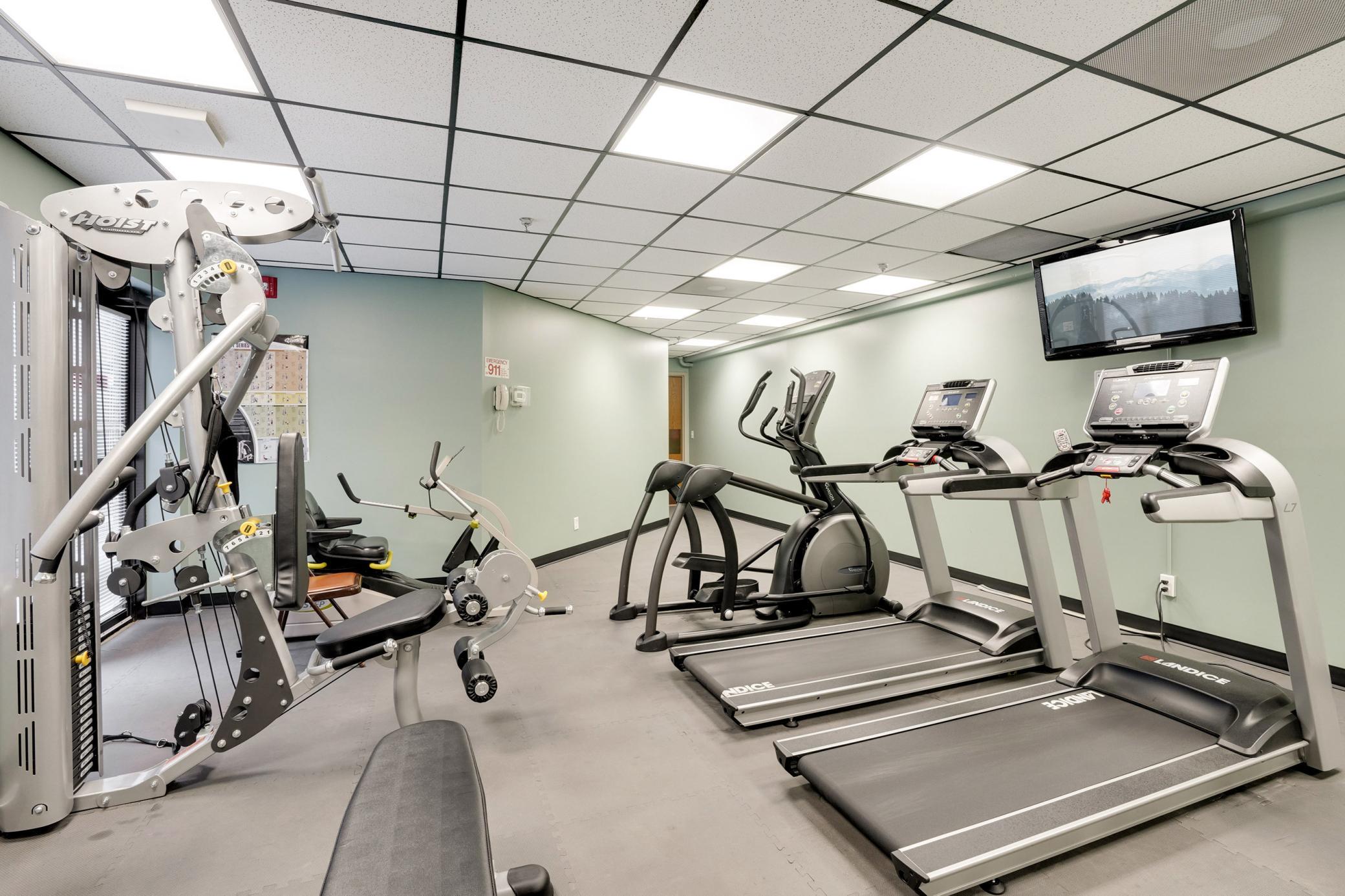 Exercise room with his and her Saunas
