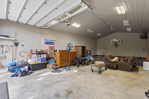 Heated 60x32 outbuilding offers exceptional flexibility for storage, hobbies, vehicles, and toys. The rear half is transformed into a private indoor sport court featuring a true 3-point line, perfect for recreation, entertaining, and year-round fun.