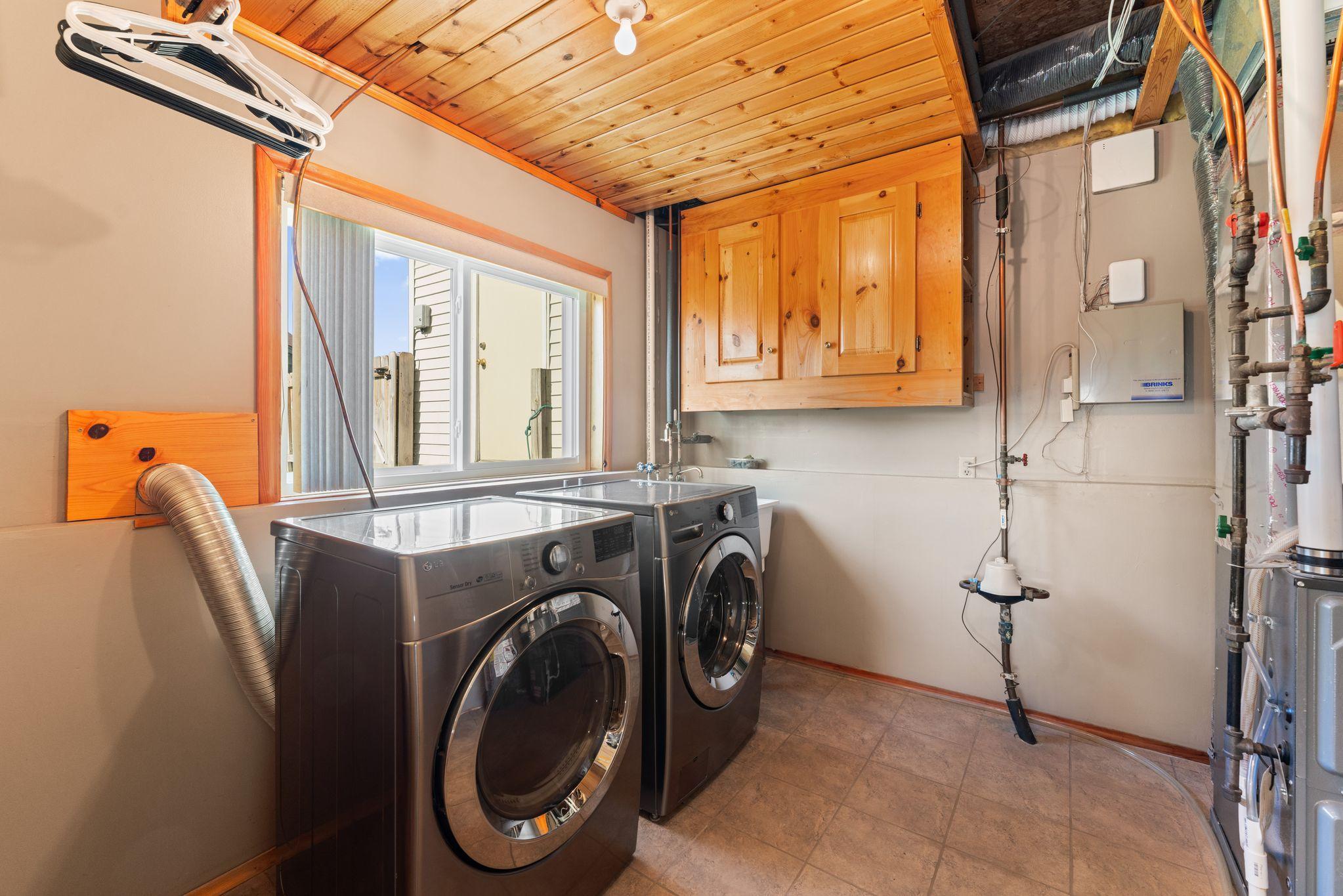 Spacious Laundry/Utility room with lookout window