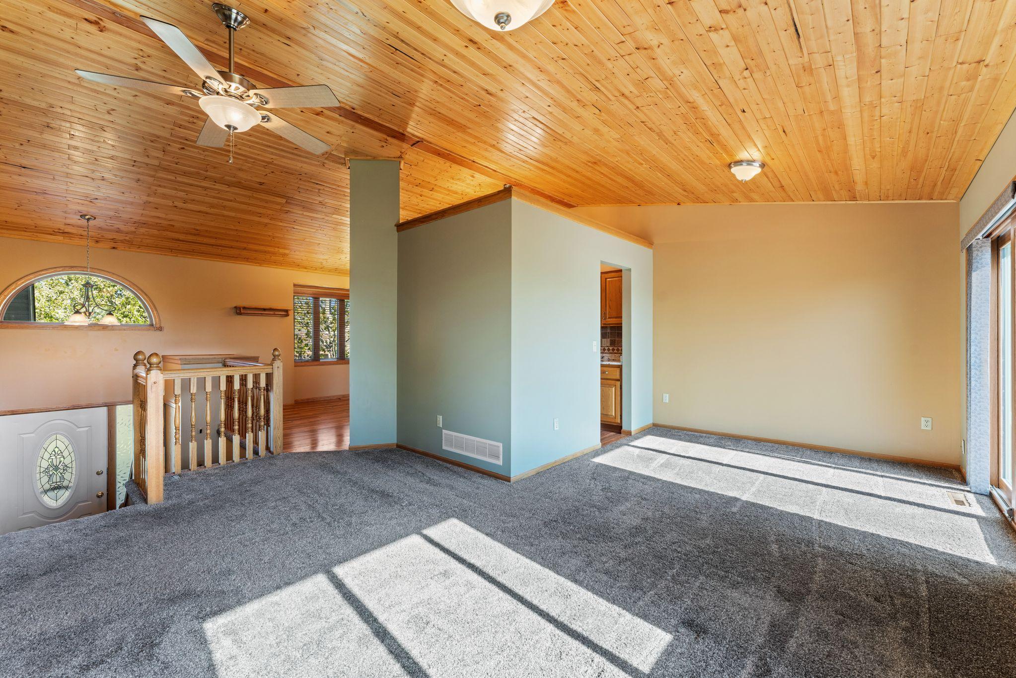 Upper level living room open to kitchen