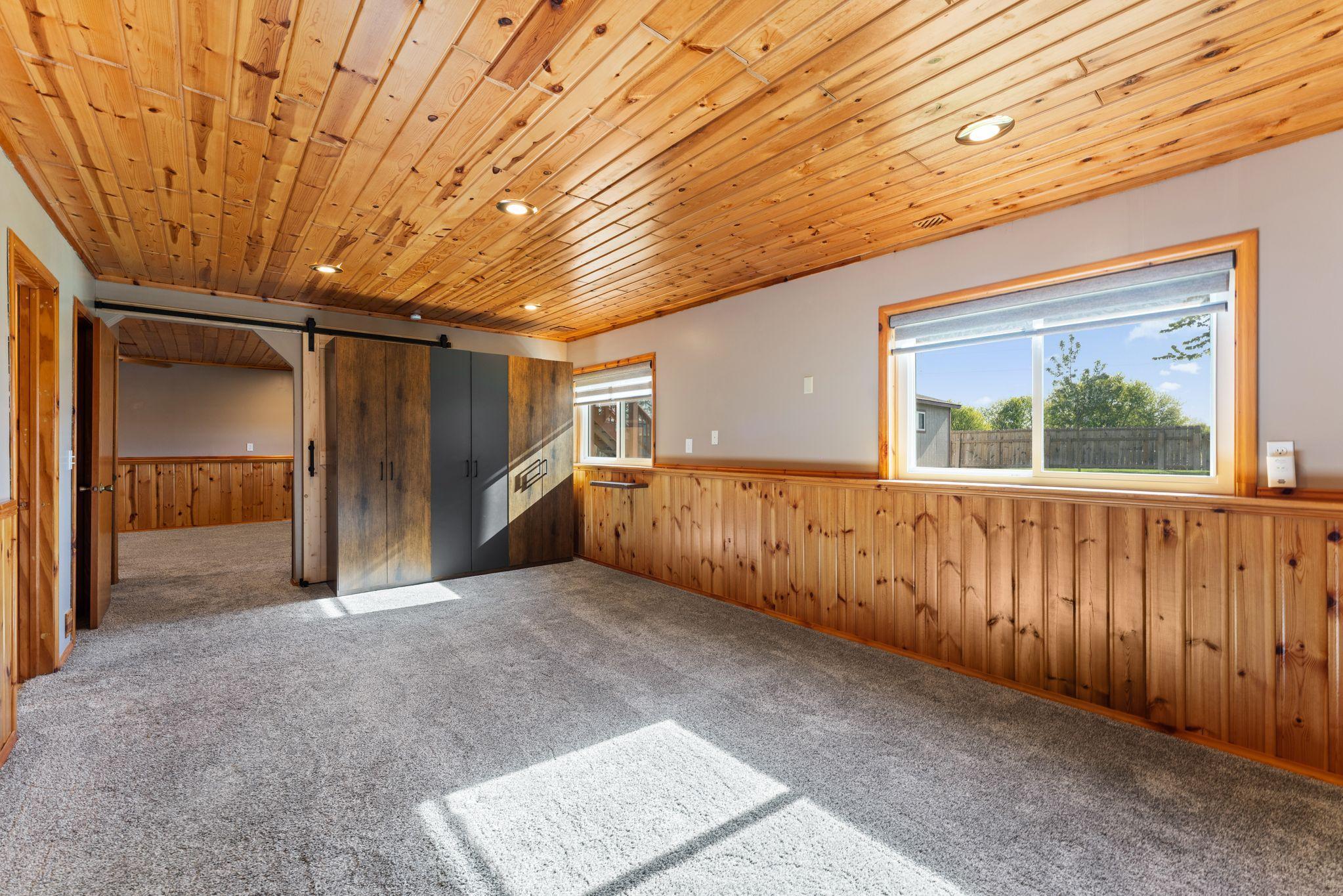 Large lower level bedroom with lots of light