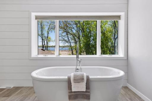 Owner's suite private bathroom with spa-like amenities including a soaker tub.