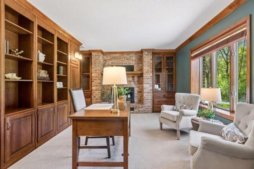 Main-level flex room provides ideal space for remote work, creative pursuits, or a private study.