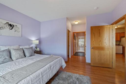 Look at that primary bath just steps away and a huge walk-in closet on one side and another closet on the other side. No more sharing if you don't want to!