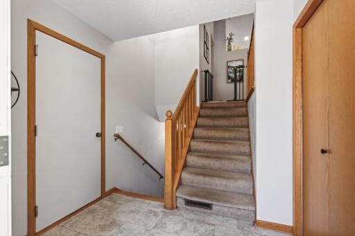 Stairs off the garage and front entry. Coat Closet convenient upon entry.