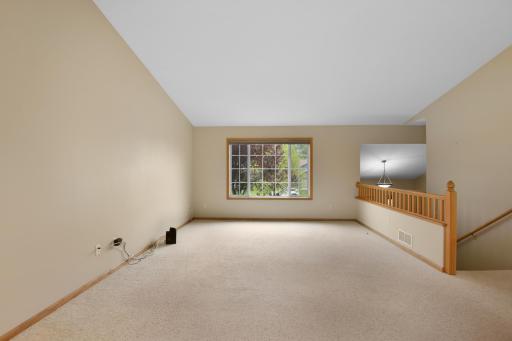 Open to the kitchen and dining, the living room has a great view and offers ease in conversation while entertaining