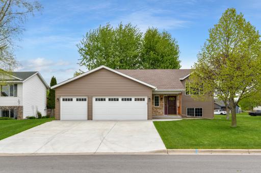 Great location and curb appeal with low maintenance exterior & triple garage!