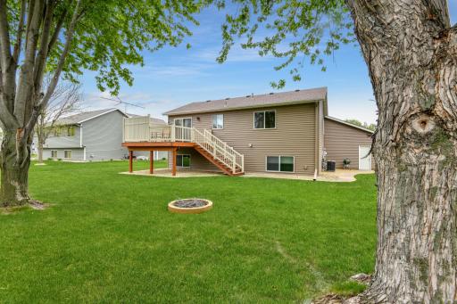 A grilling patio is located just beyond the deck
