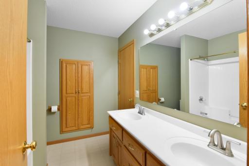 Built-in cabinets provides ample storage in the main bath