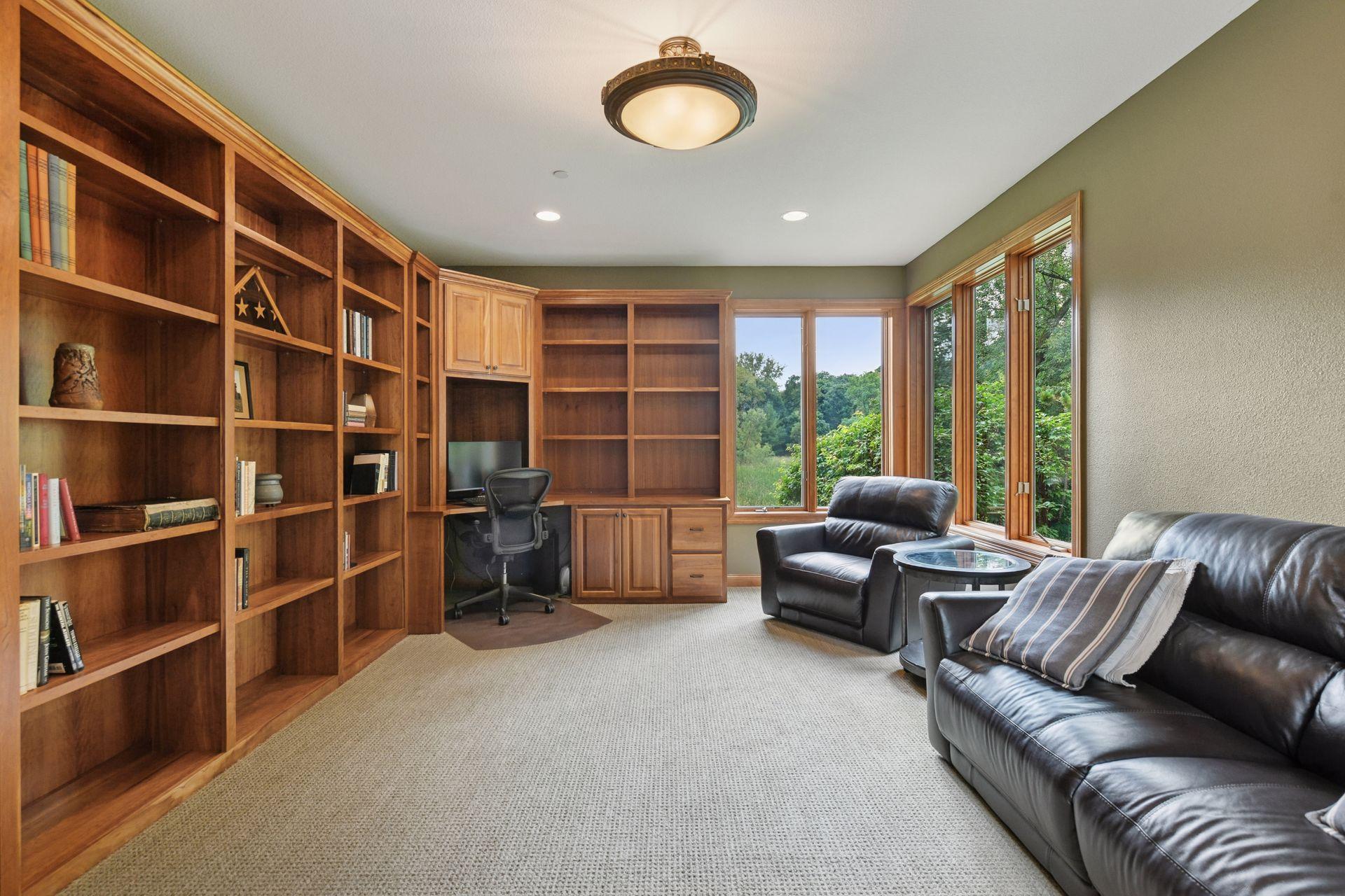 The main floor office has built-in cherry bookcases, cabinets, and workstation