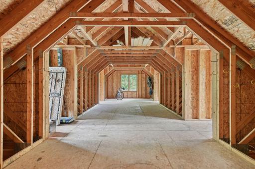 Stairs in the garage lead to this storage area over the garage (possible future expansion)