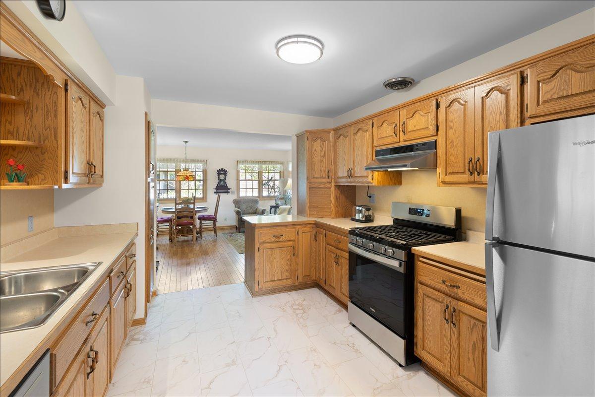 Large open kitchen with SS appliances and new LVP flooring