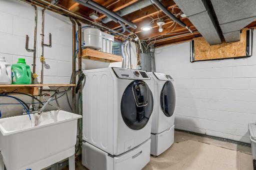 Samsung Steam washer and dryer set with pedestals.