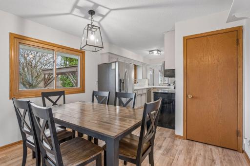 Spacious dining space for easy family dinners and also overlooks the backyard. Adjacent closet pantry.