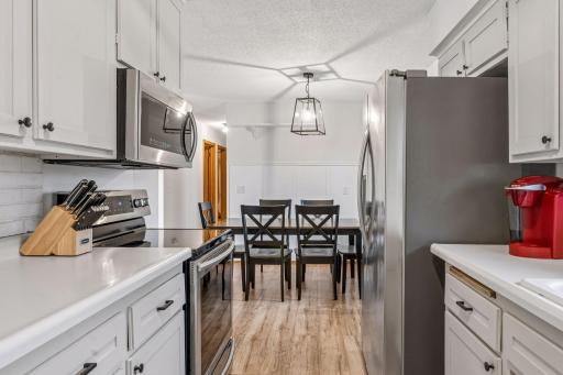Updated kitchen appliances including an osmosis water filter system.
