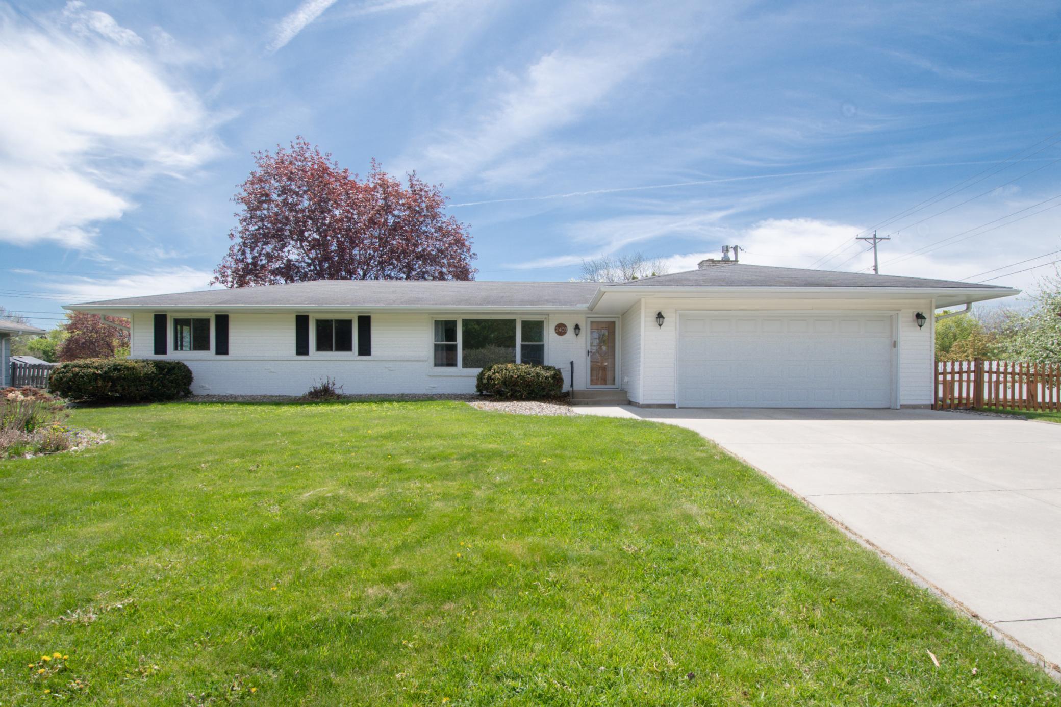 Fabulous updated rambler on a beautifully maintained lot with large front and back yards.