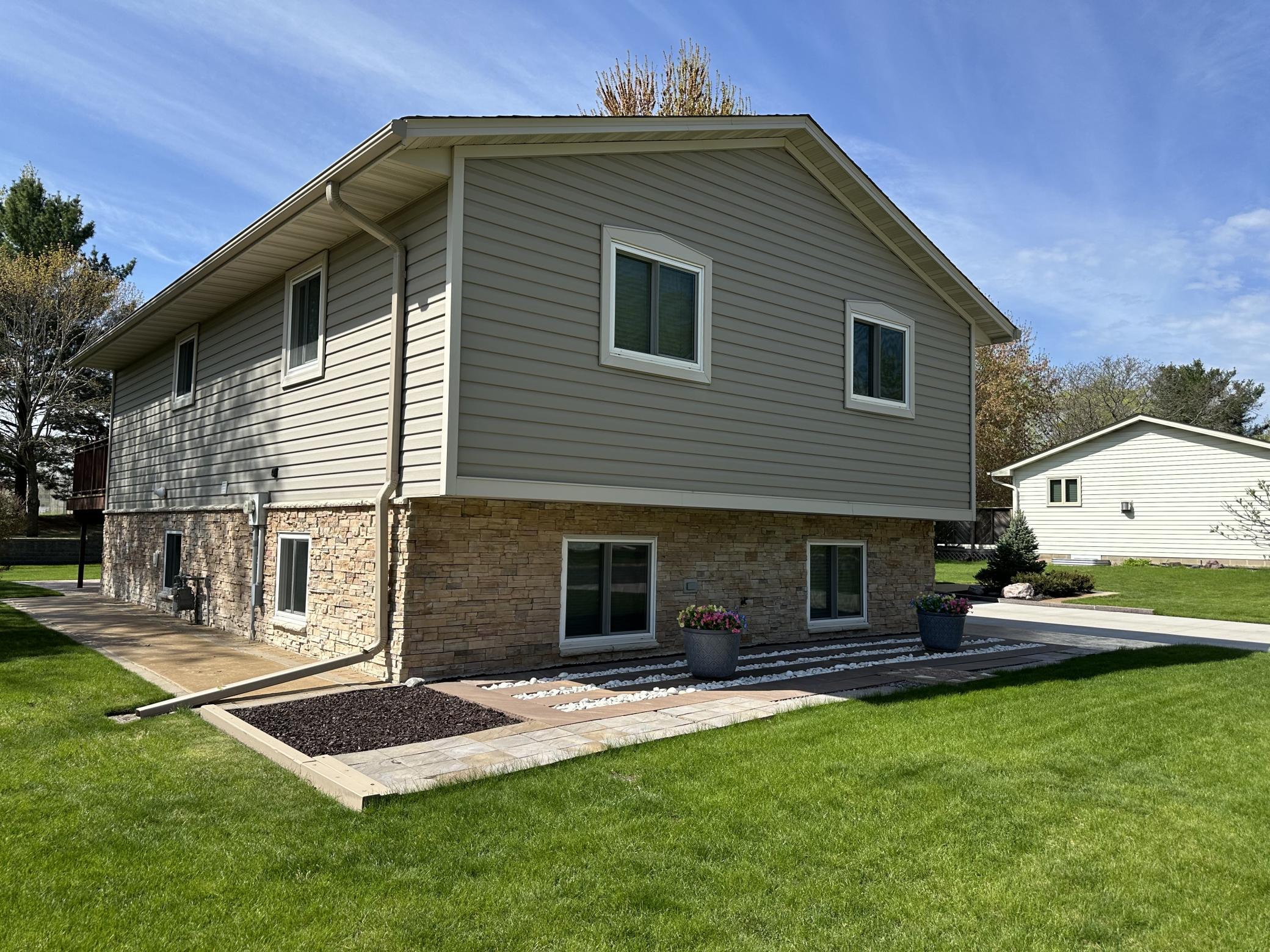 Gorgeous Detailed Landscaping, Seamless Steel Siding and Stone