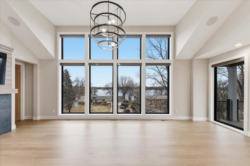 Huge wall of windows to overlook Bald Eagle Lake! This is a photo of a previous build from Hampton Companies.