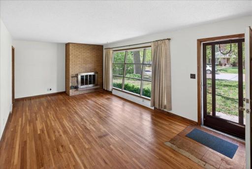 Original hardwoods and wood burning fireplace