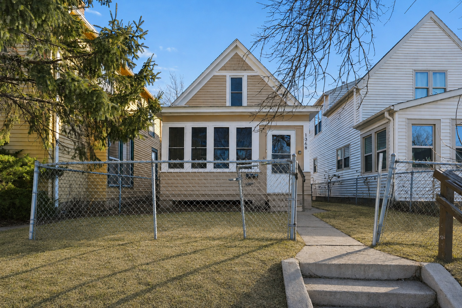 Inviting exterior view highlighting the classic architecture and cozy front entry.