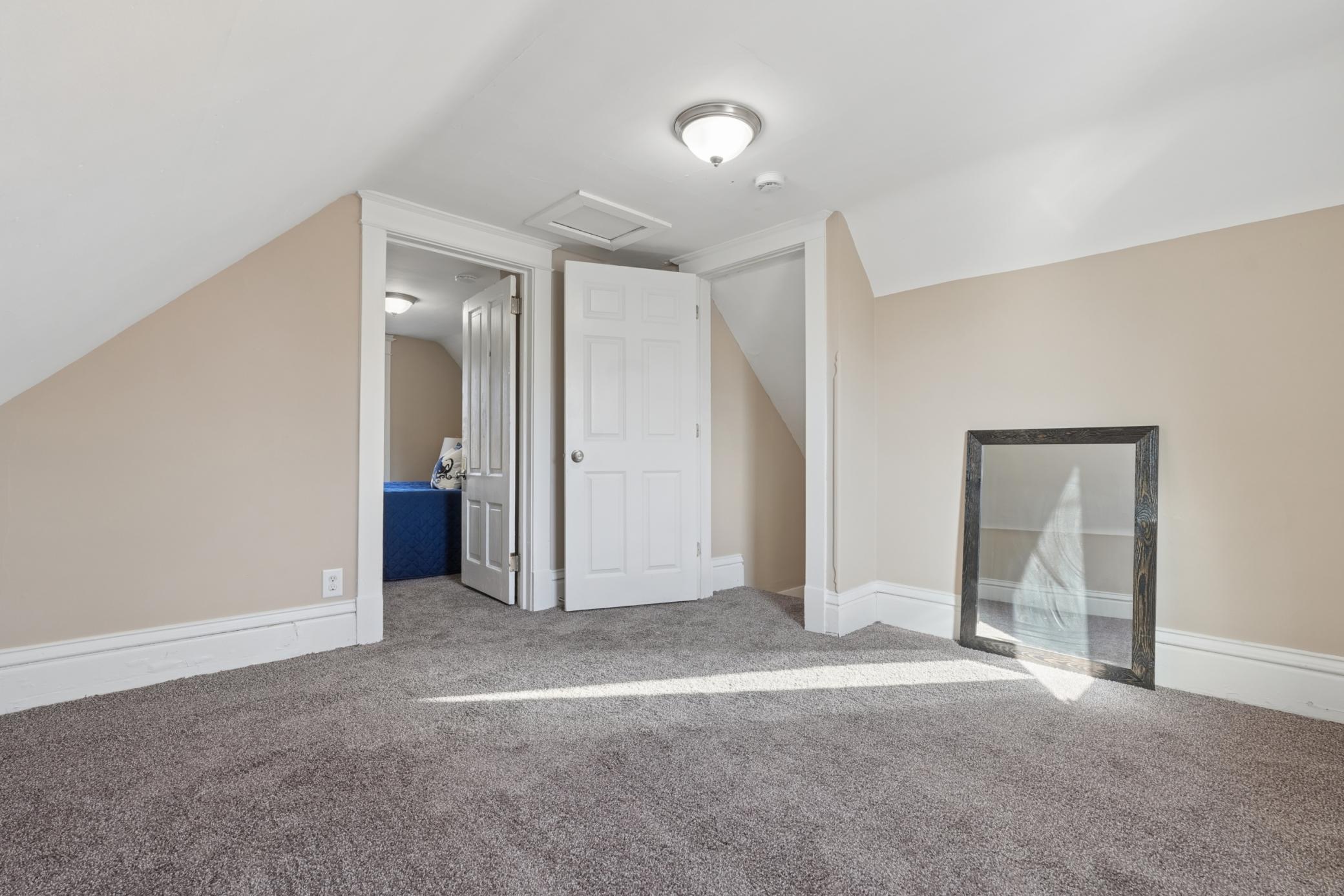 Alternate upper-level view showing generous floor space.