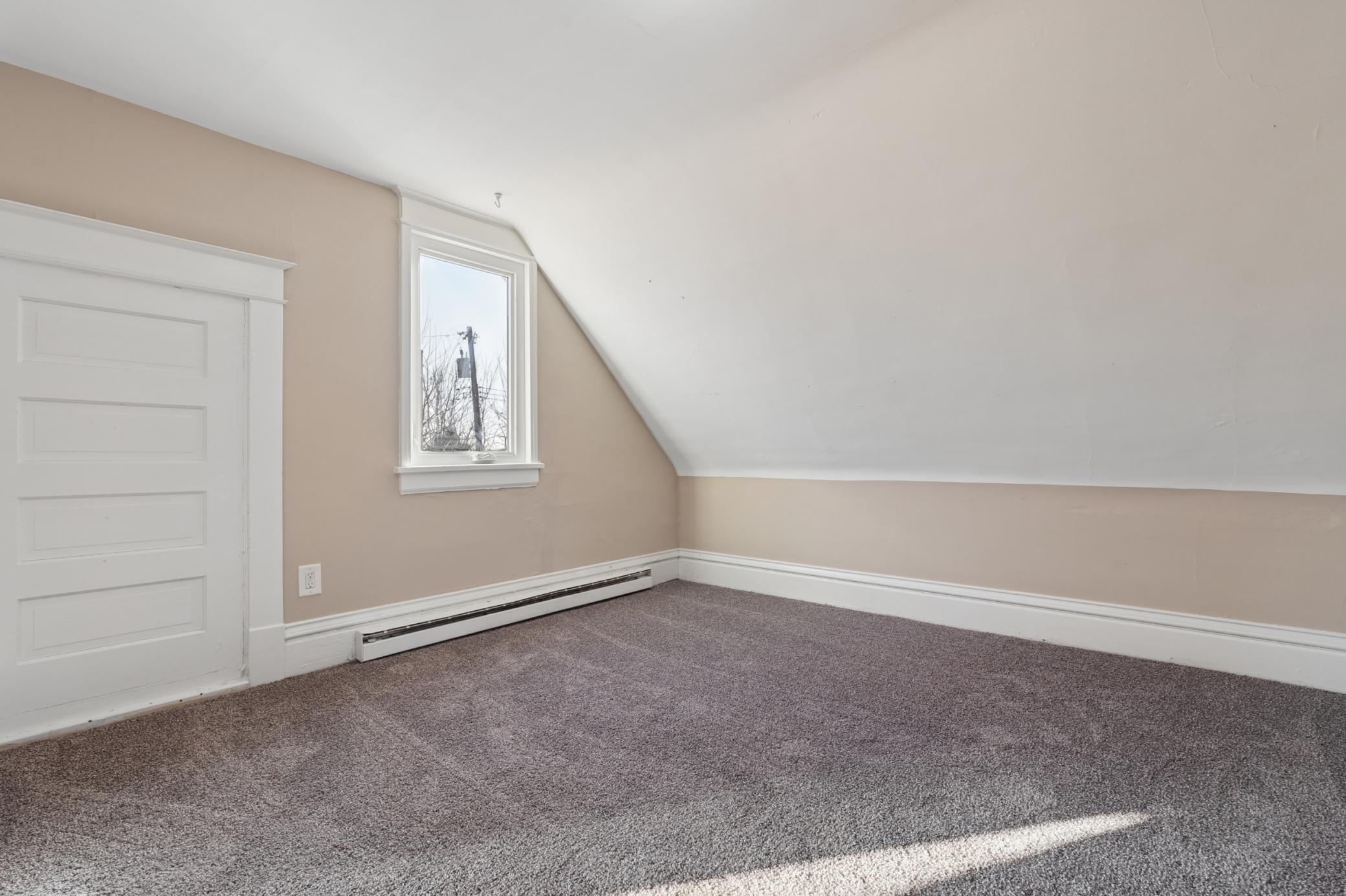 Alternate upper-level view showing generous floor space.