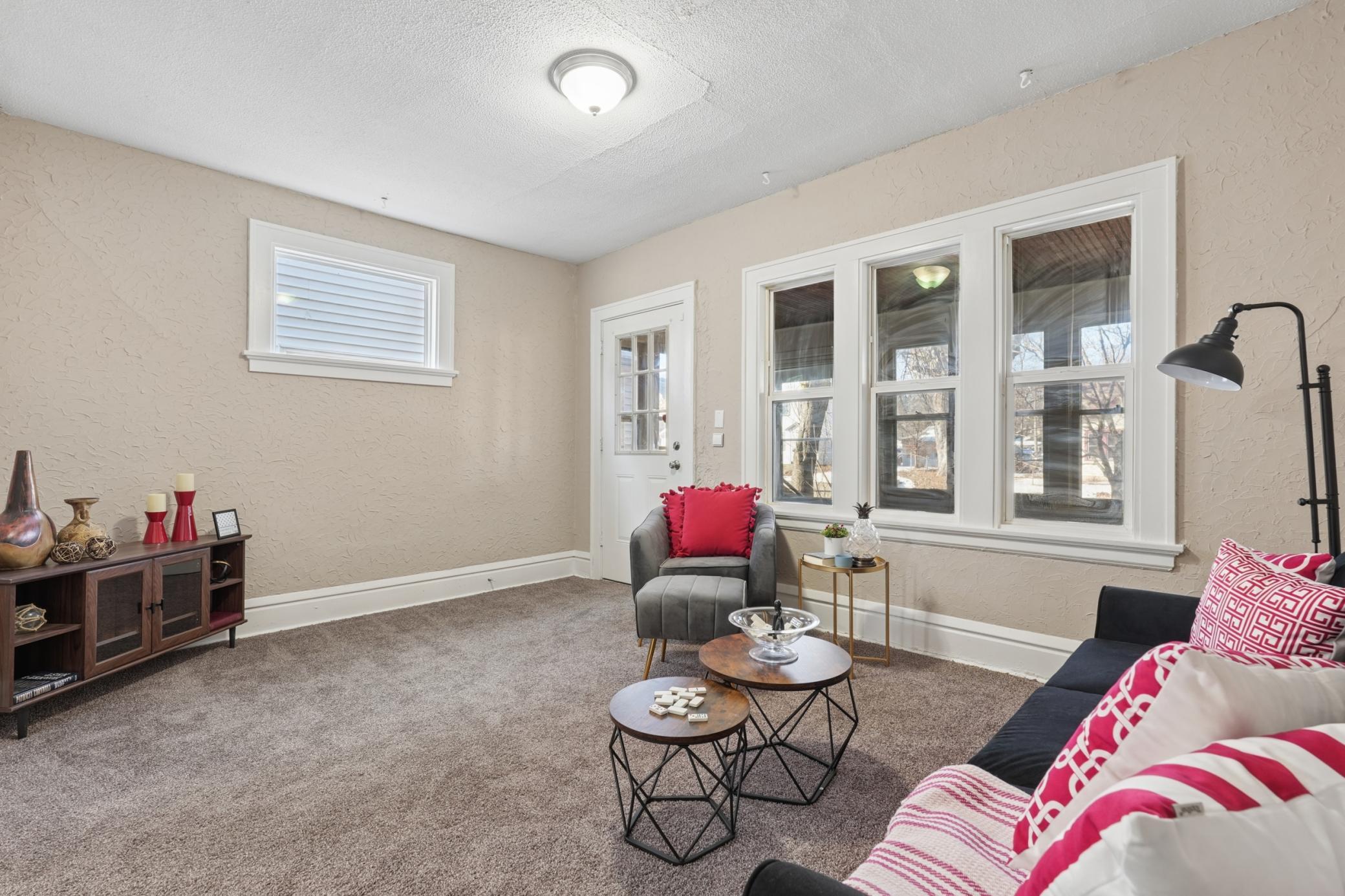 Living room with large windows providing abundant natural light.