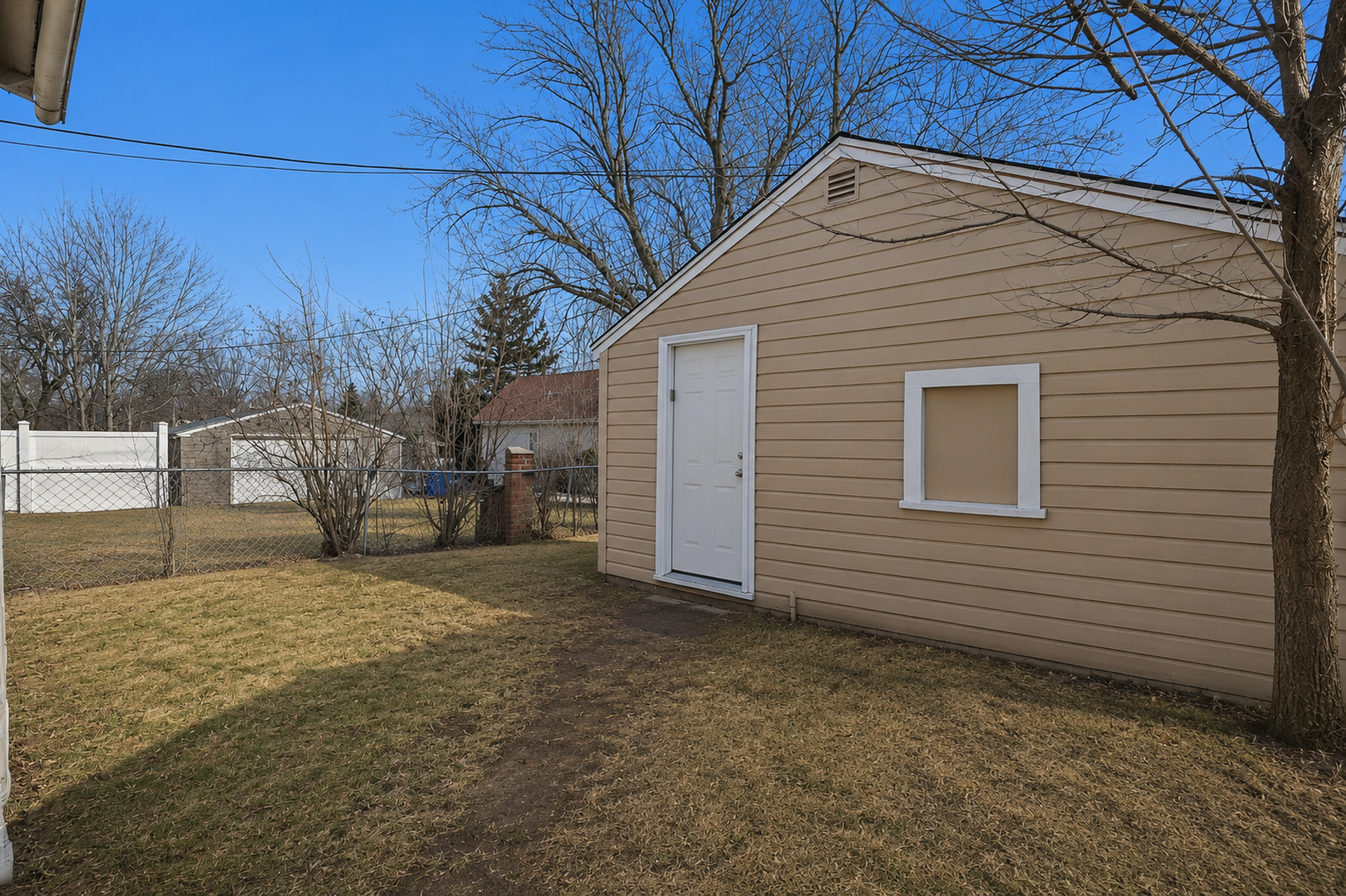Fully fenced backyard offering privacy and room for outdoor enjoyment.