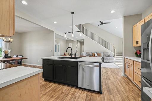 Full main floor overview showing kitchen, island, and stair access â 2023 Le Center MN home, Tri City United schools.