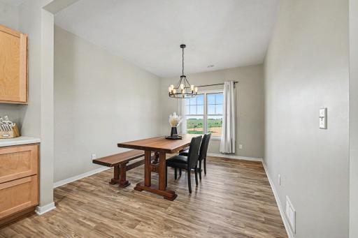 Dining area with natural light and LVP flooring â 2023-built Le Center MN home