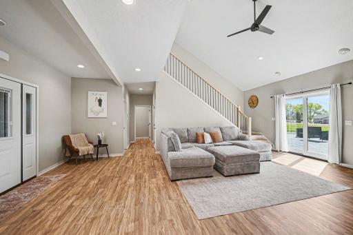 Sun-filled living room with LVP flooring and large windows â Le Center MN home for sale