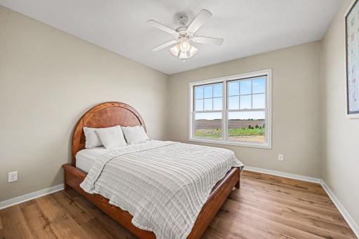 Upper bedroom with LVP, ceiling fan, country views â Le Center MN