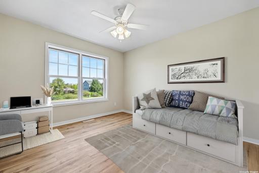 Upper bedroom with LVP floors, large window, natural light