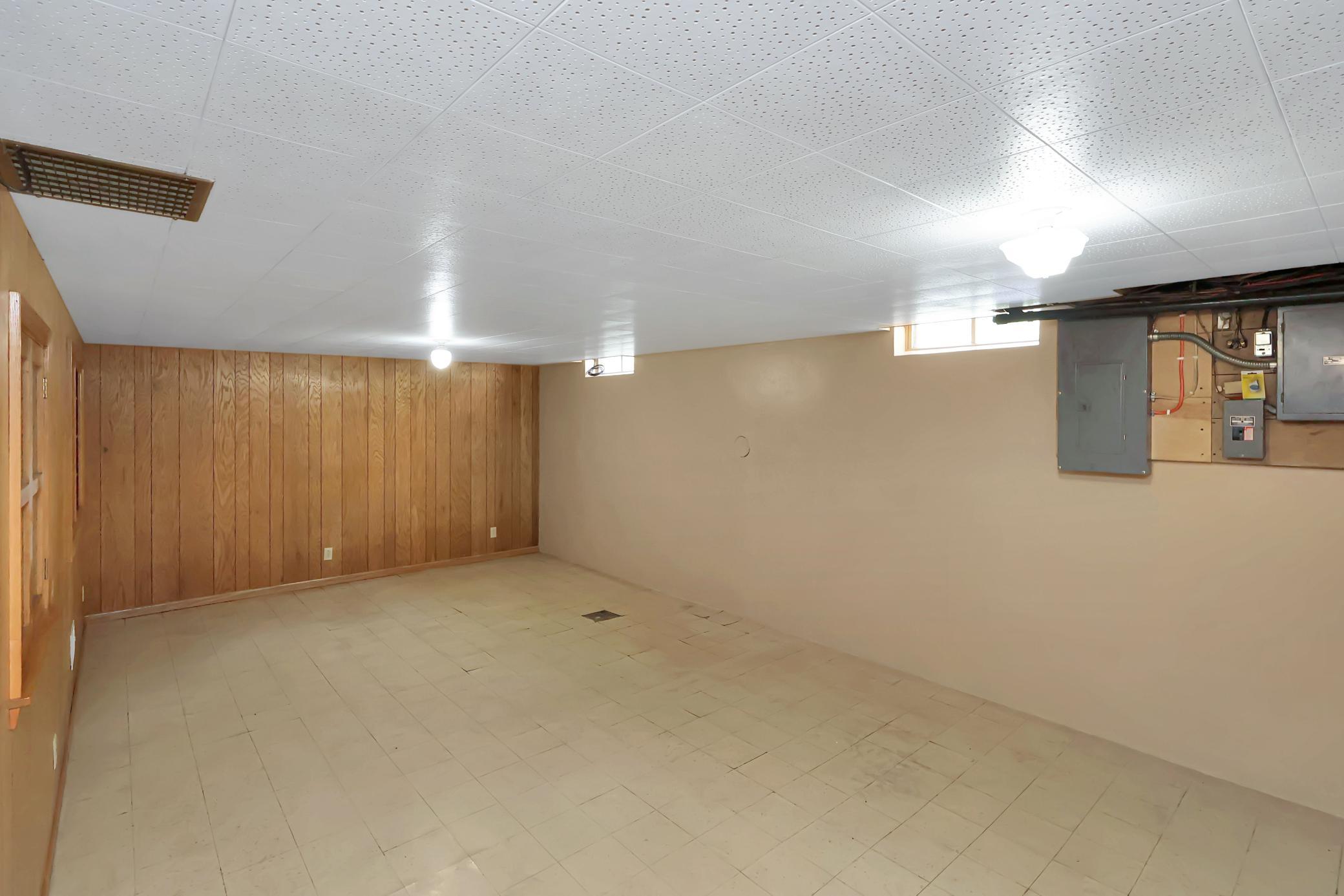 Partially finished lower level- family room area.