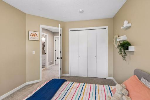 The second bedroom up has a large closet with double doors and organizers.