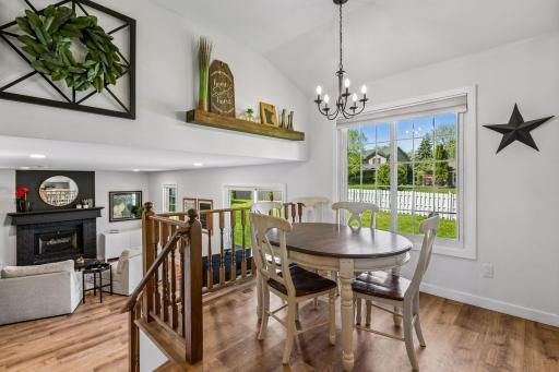 The informal dining area has solid surface flooring for easy clean up and a large picture window overlooking the private fenced yard. This space is also open to the family room.