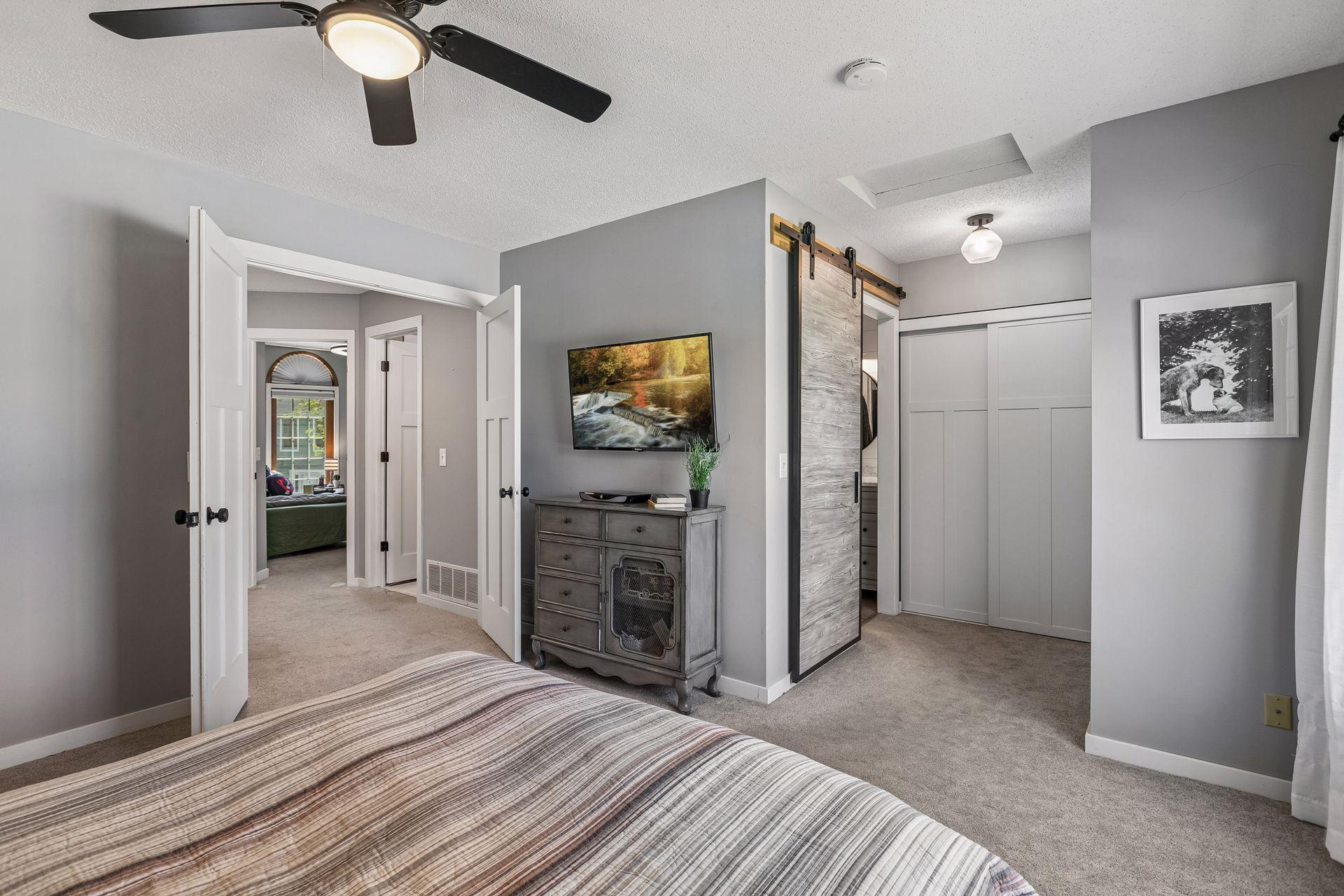Enjoy updated paneled doors throughout the home. There is even a fun barn door into the owners bath.