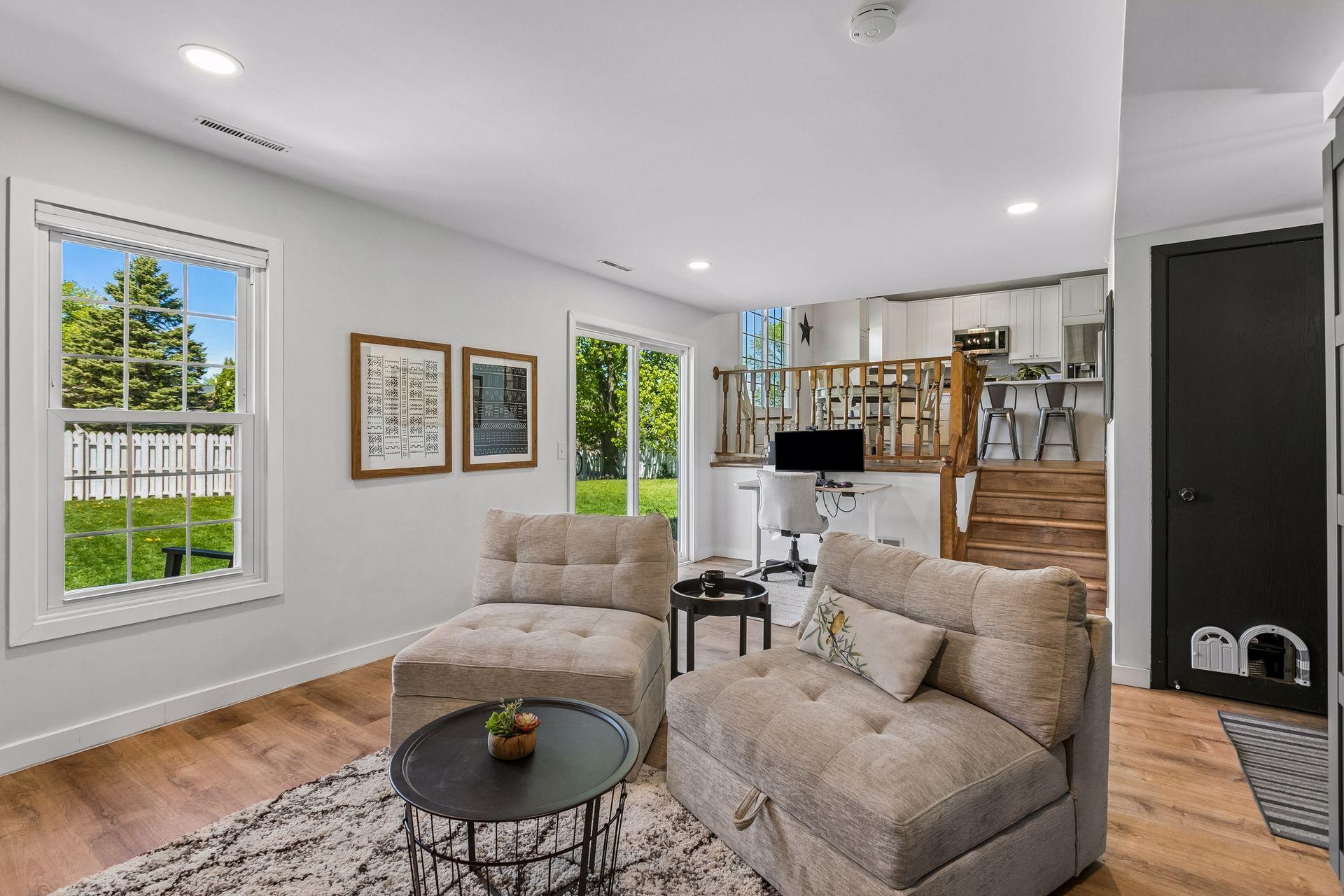 The main floor family room is spacious and bright with solid surface flooring for easy clean up, recessed lighting and a sliding door to the spacious, fully fenced back yard with 2 decks.