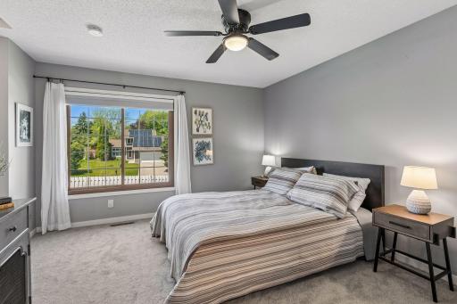 The owners suite on the upper level has plenty of space for a king bed. It features a large picture window overlooking the back yard, a breezy celing fan, 2 closets, double doors and a private 3/4 bath.
