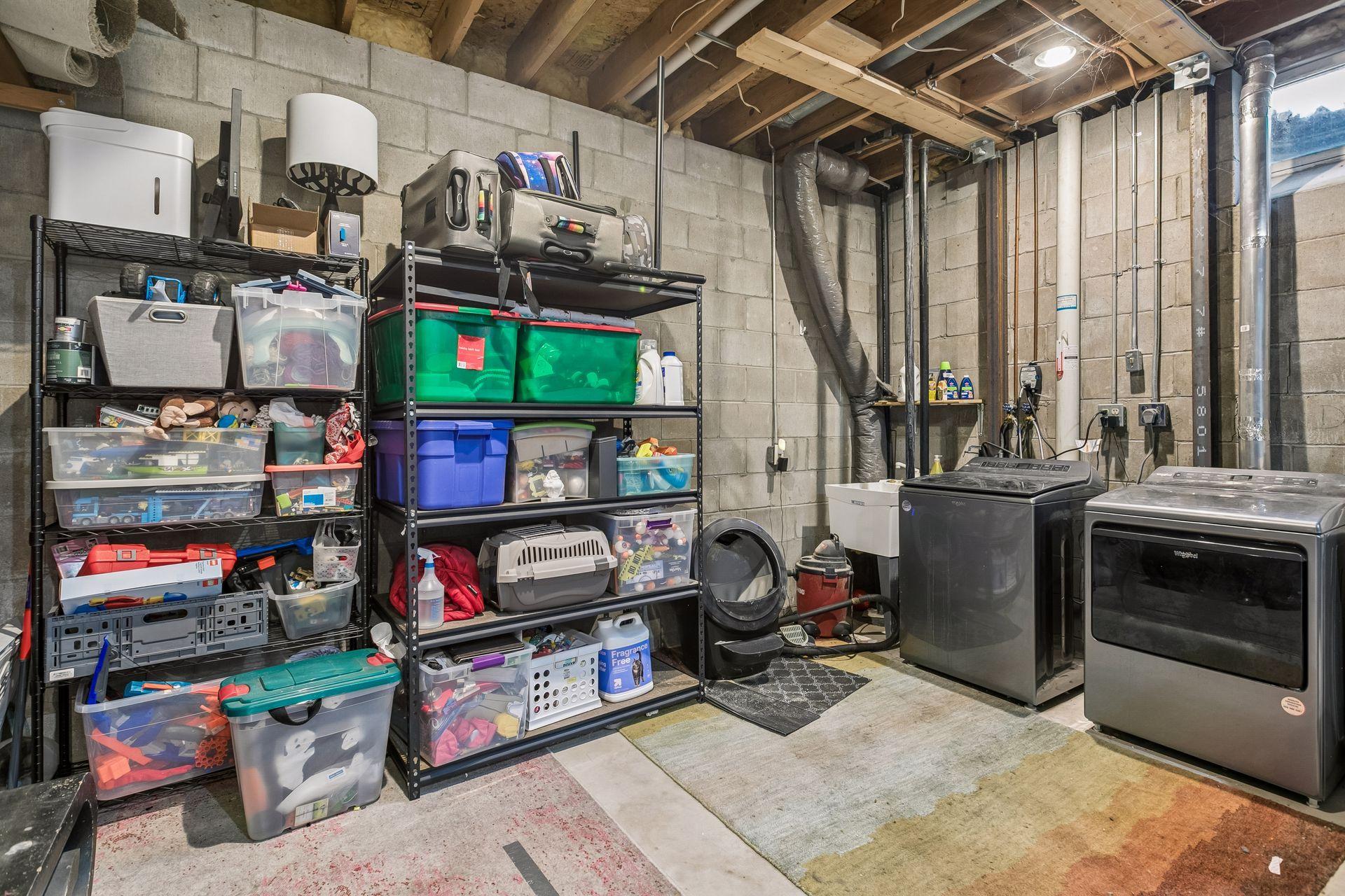 The laundry area has a handy wash tub. There is also a radon mitigation system for this space.