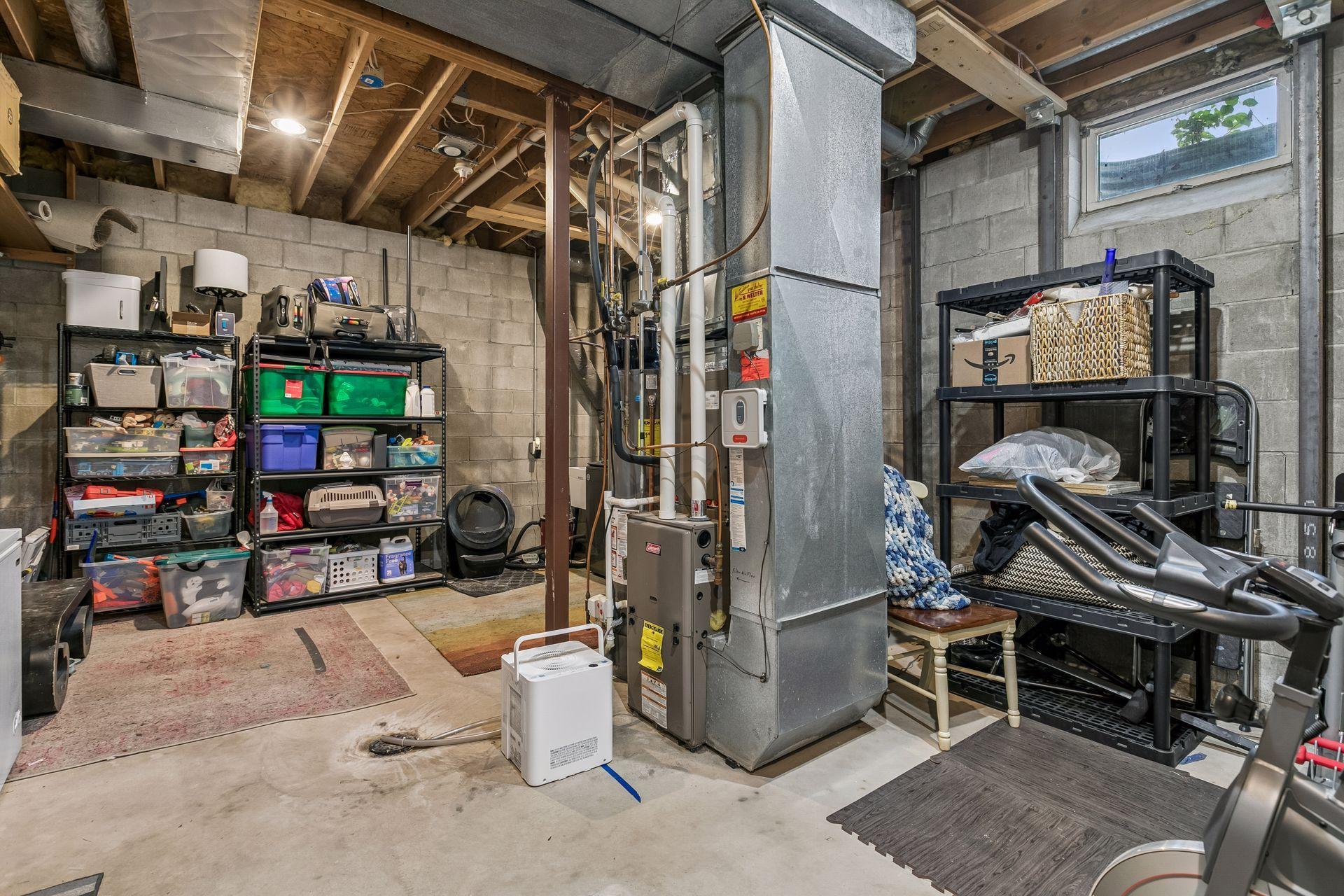 The lower level laundry/utility space has high ceilings and plenty of room for storage.