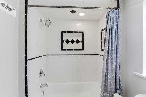 The space feels crisp and functional, offering convenient main-floor access.