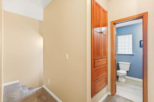 A stylish hallway built-in with crisp finishes and classic farmhouse charm. The built-in provides practical storage while enhancing the homeâs overall aesthetic.