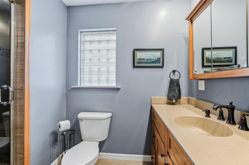 A stylish upper-level 3/4 bath blending modern updates with farmhouse charm.