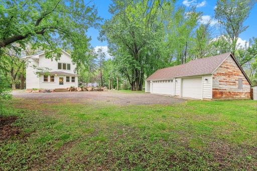 Two spacious garage/outbuildings ideal for parking, workshop use, or extra storage.