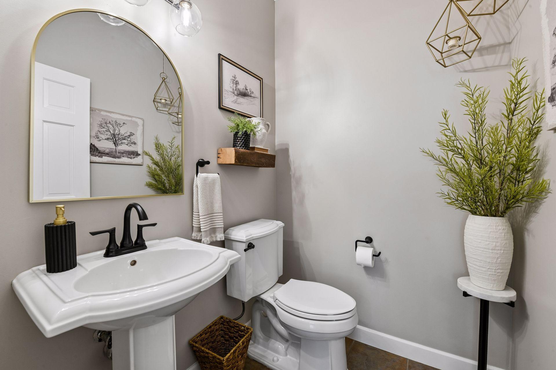 The Powder Room has been updated with new, designer fixtures.